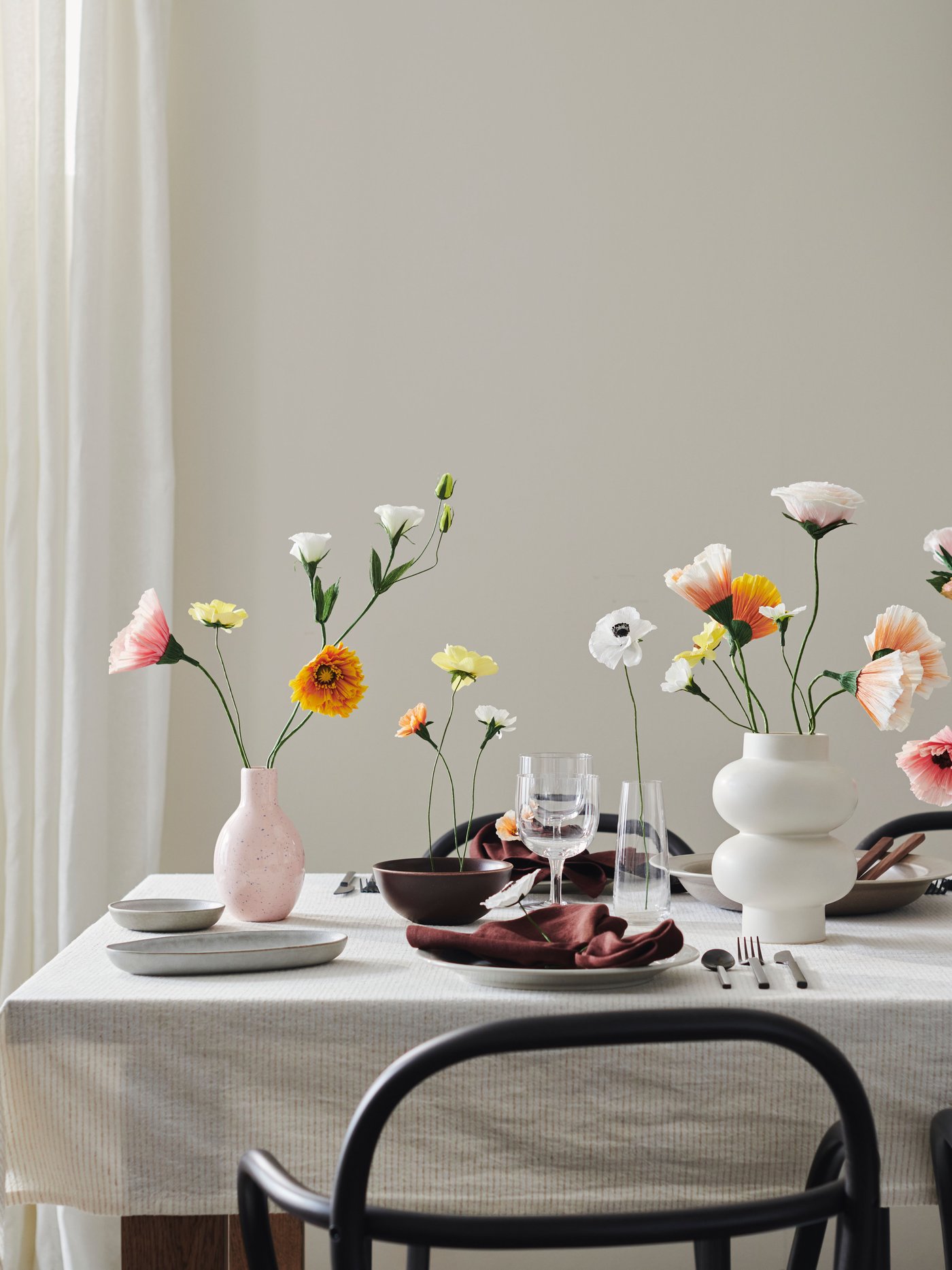 A pale pink/blue BLODBJÖRK vase in the dining room