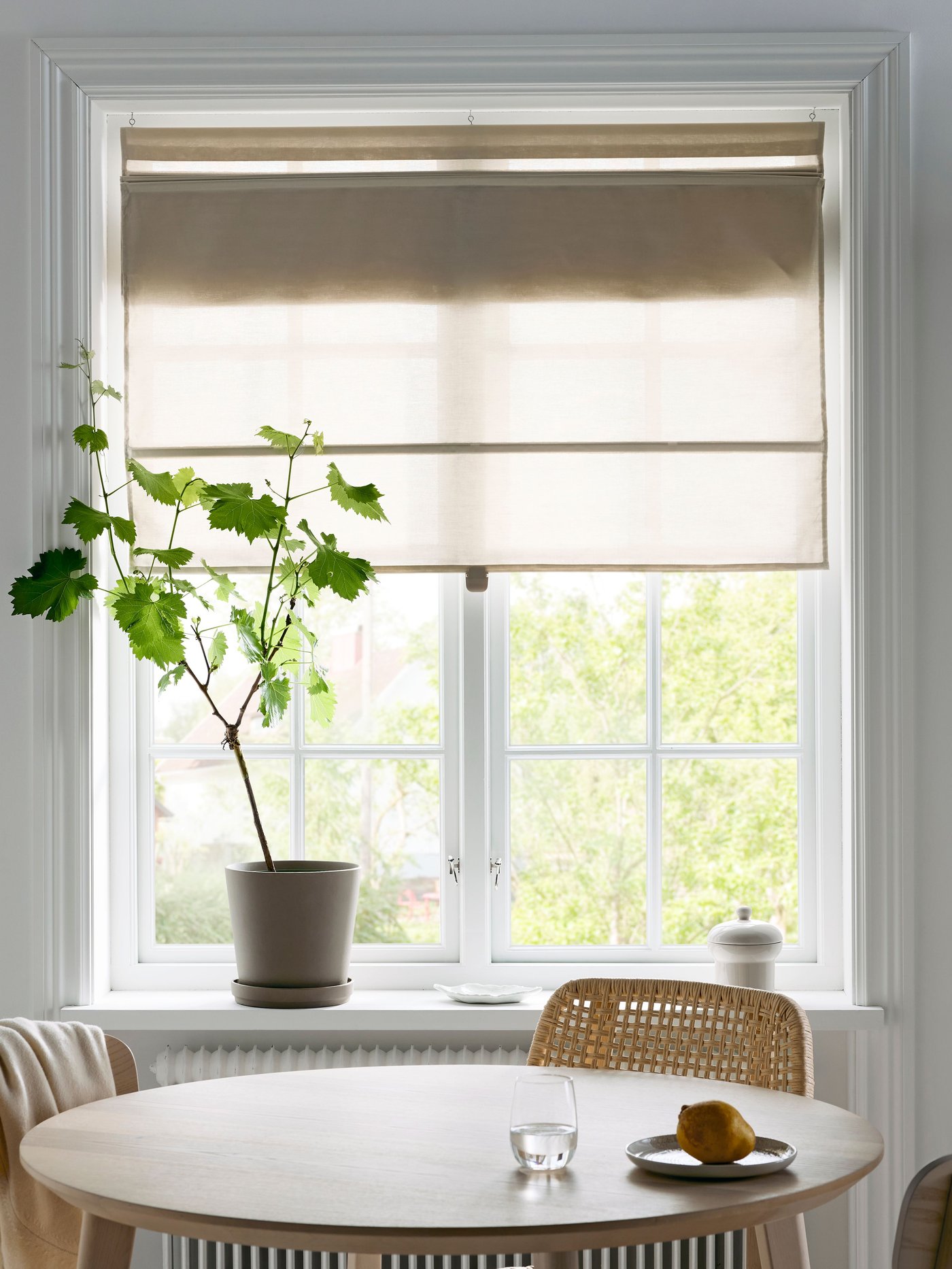 A beige RINGBLOMMA Roman blind