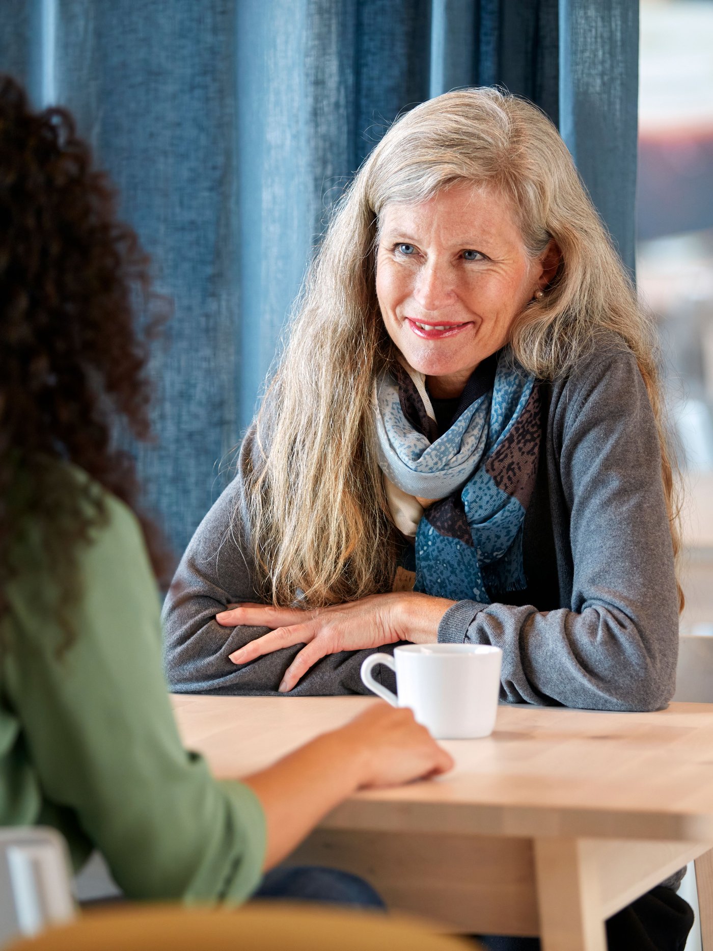 Woman drinking coffee.