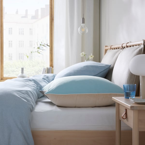 A beige/blue KEJSAROLVON pillow protector