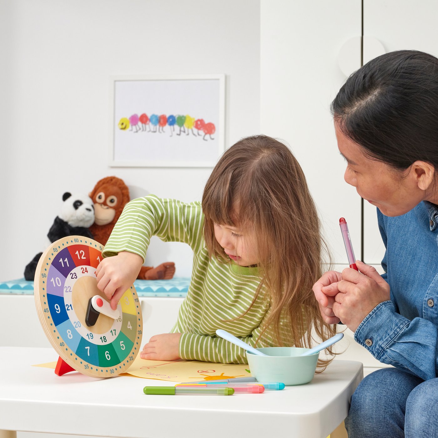 A multicolour UNDERHÅLLA educational wooden clock