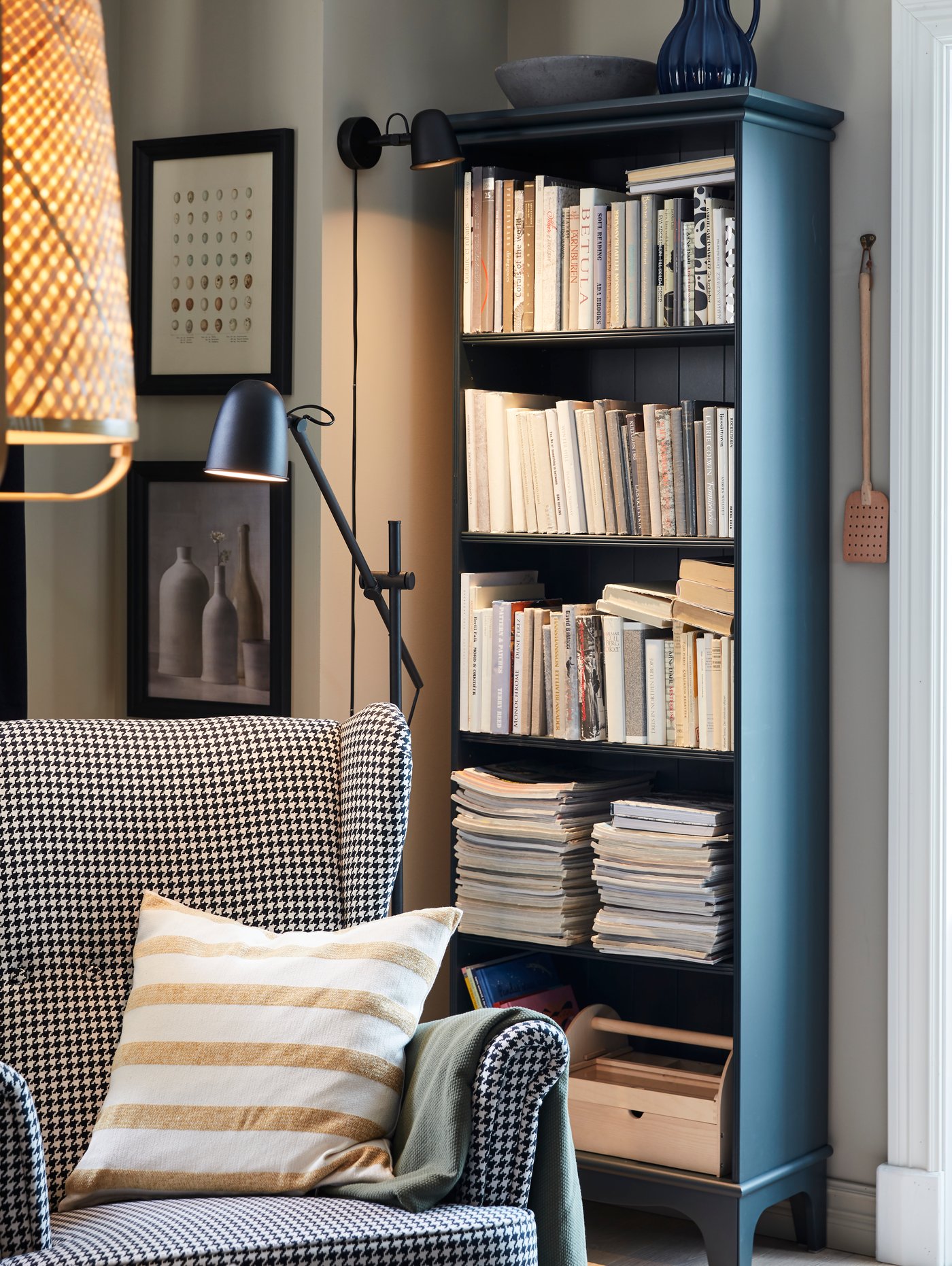 A dark blue-green LOMMARP bookcase in the living room