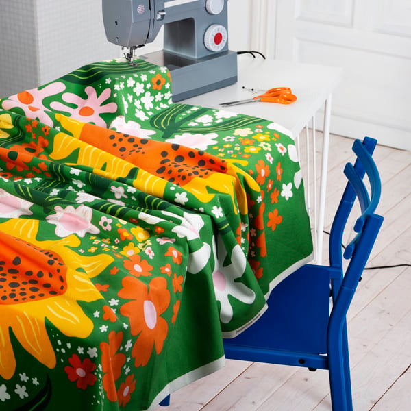 A green/multicolour floral pattern CAFEBITRÄDE pre-cut fabric in the dining room