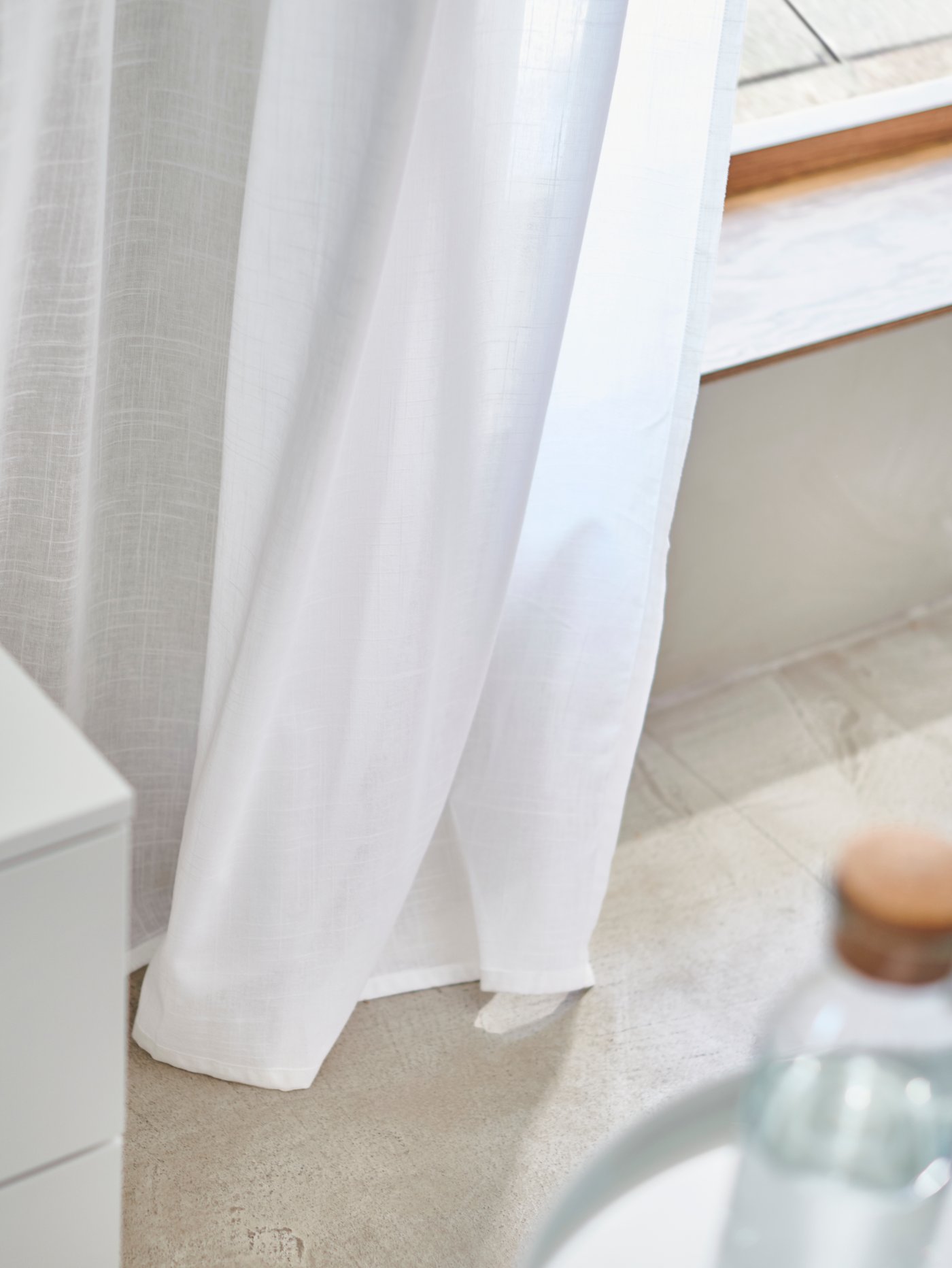 A white/with heading tape SILVERLÖNN sheer curtains, 1 pair in the bedroom