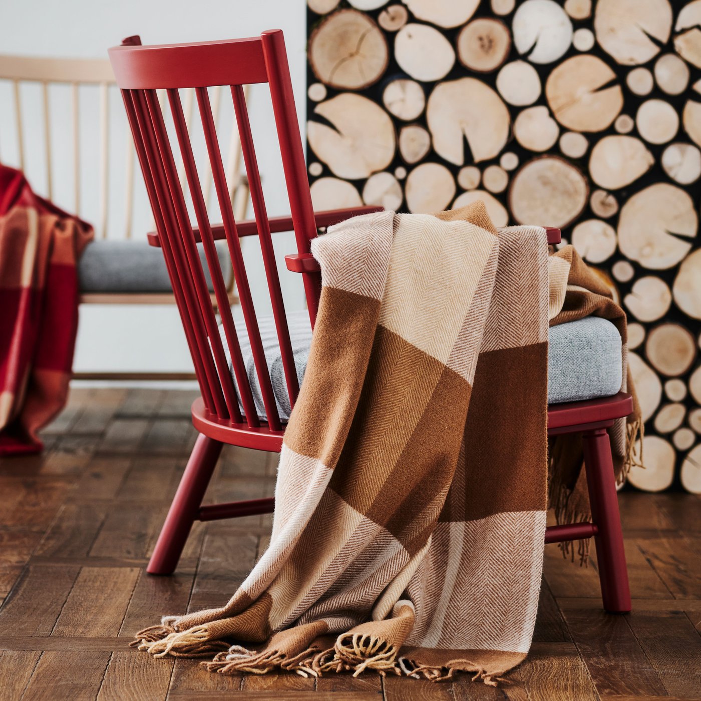 A light brown MYRULL throw