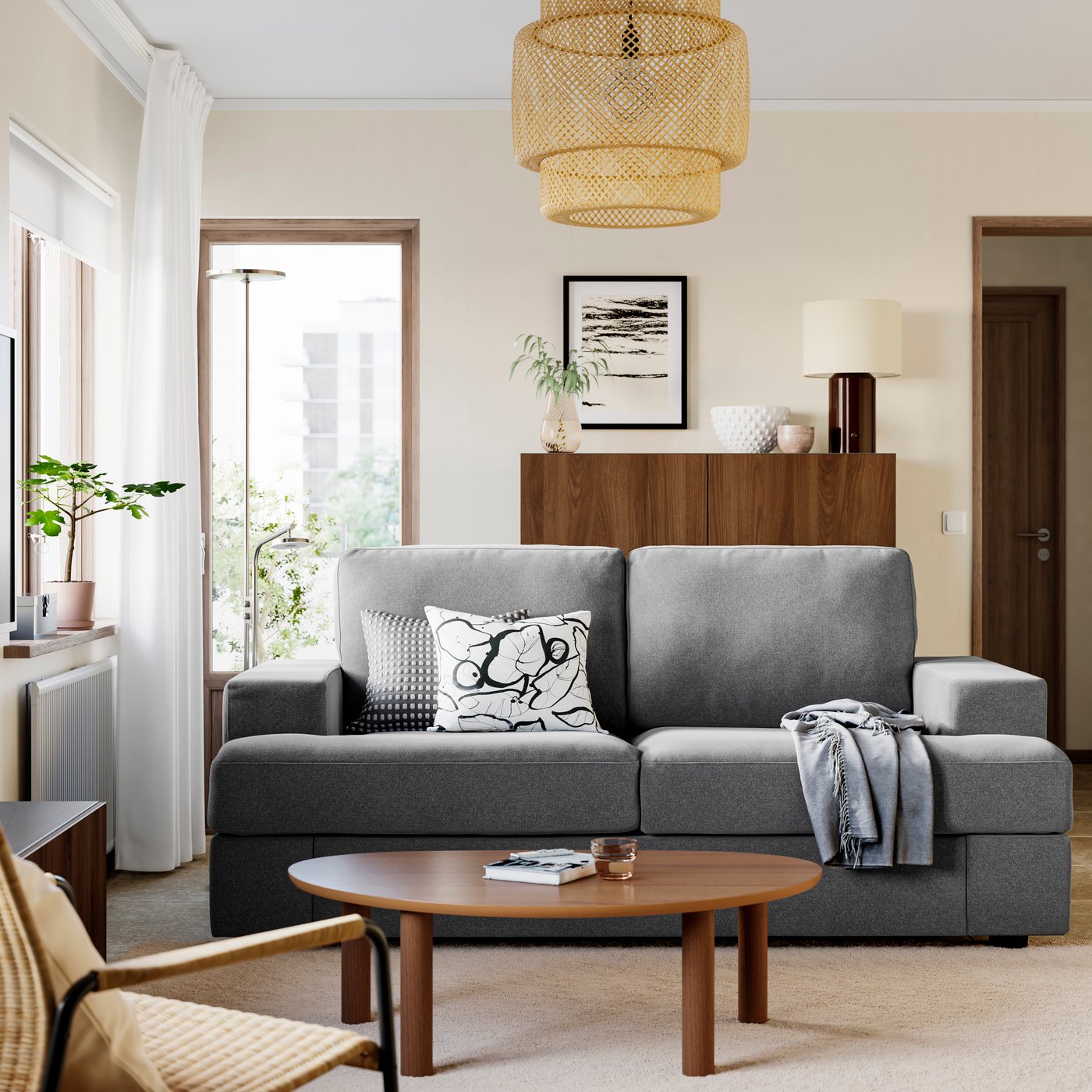 Living room with grey sofa, walnut table, and armchair
