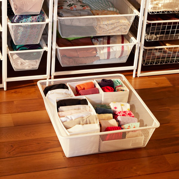 A white SKUBB box in the bedroom