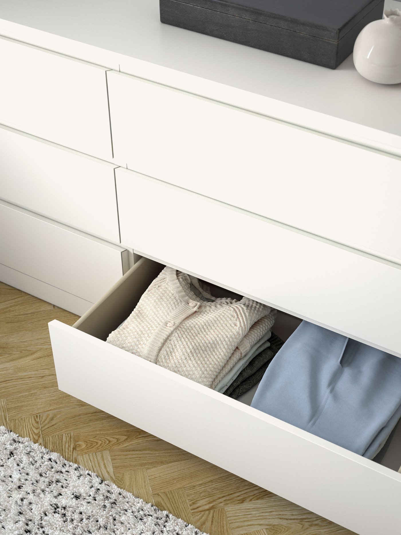 A white MALM chest of 6 drawers