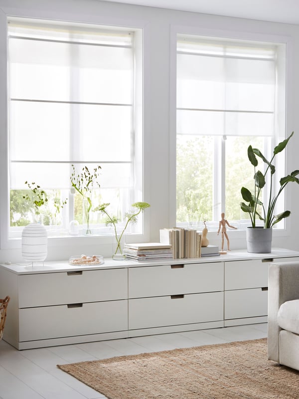 A white RINGBLOMMA Roman blind