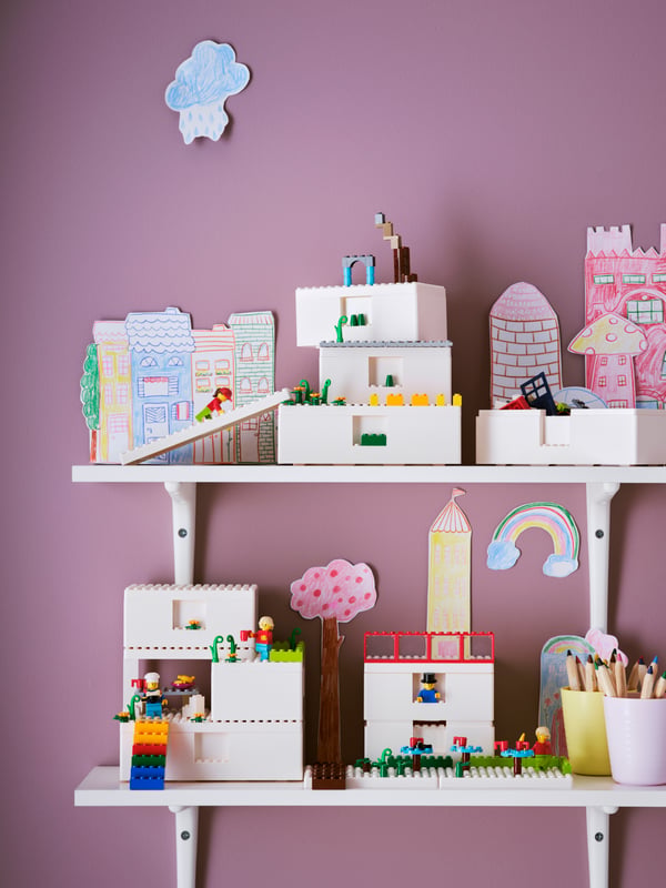 IKEA BYGGLEK 201-piece LEGO® brick set on top of two IKEA BURHULT white shelfes with SIBBHULT white brakets in the childrens room