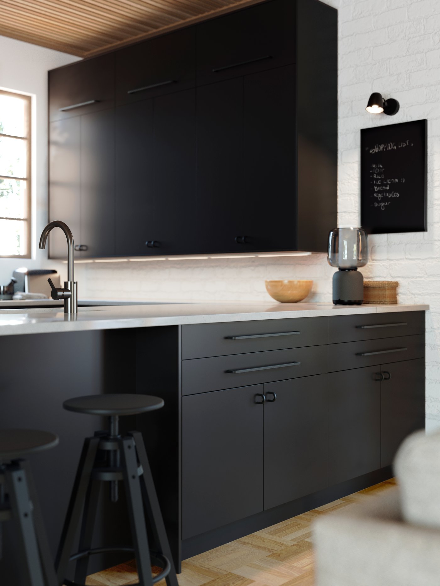 A black SKURUP wall lamp