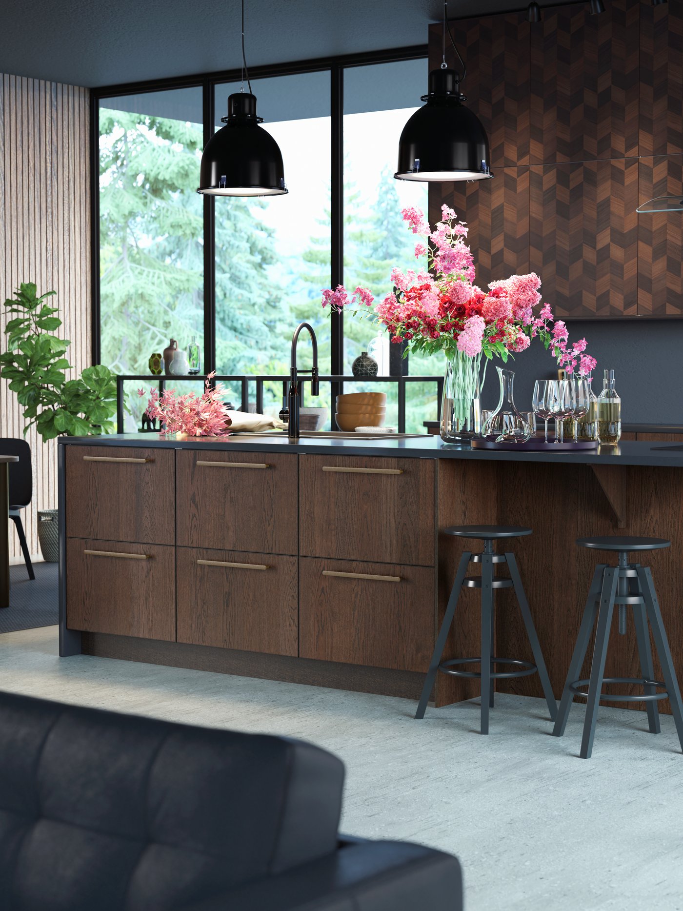 A black polished metal TOLLSJÖN kitchen mixer tap/handspray in the kitchen