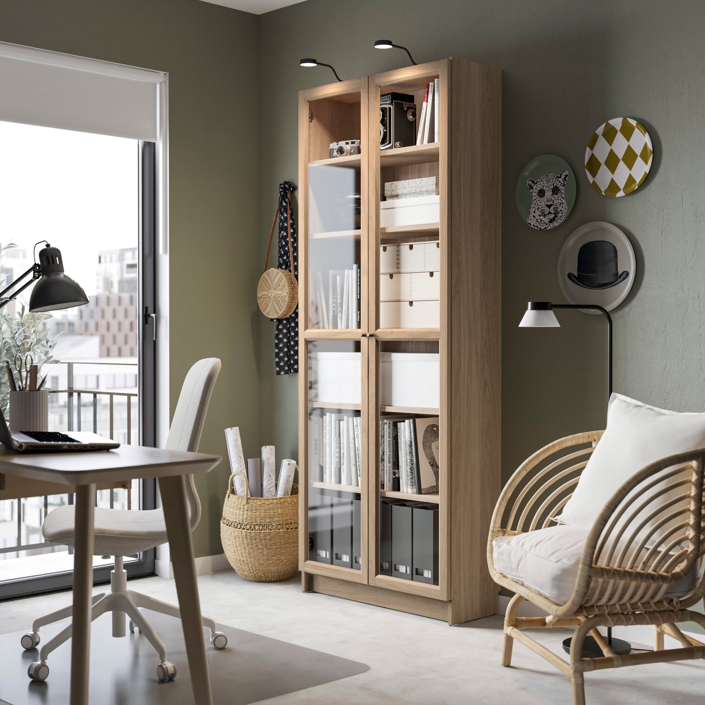 An oak effect BILLY bookcase with glass doors