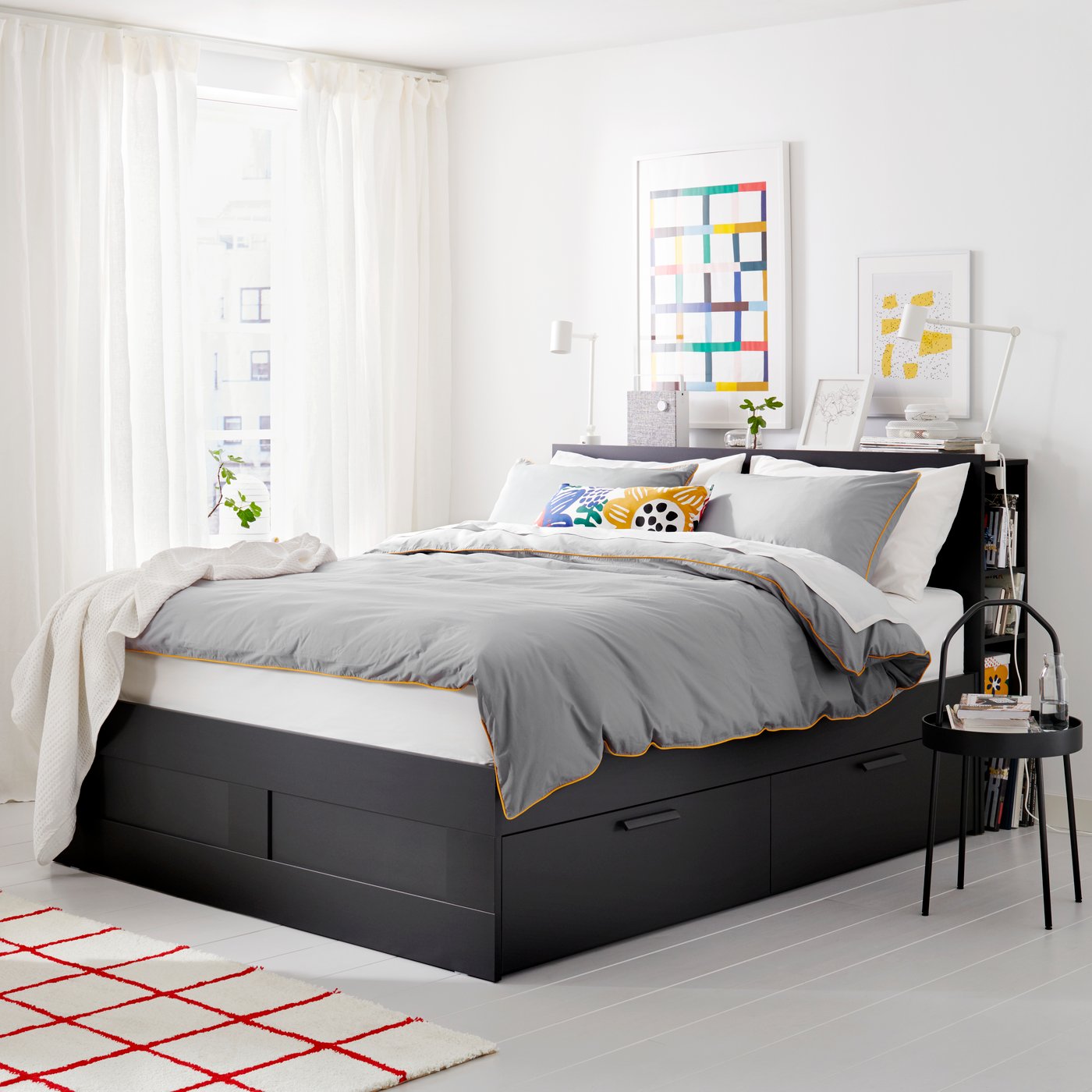 A black BRIMNES bed frame w storage and headboard