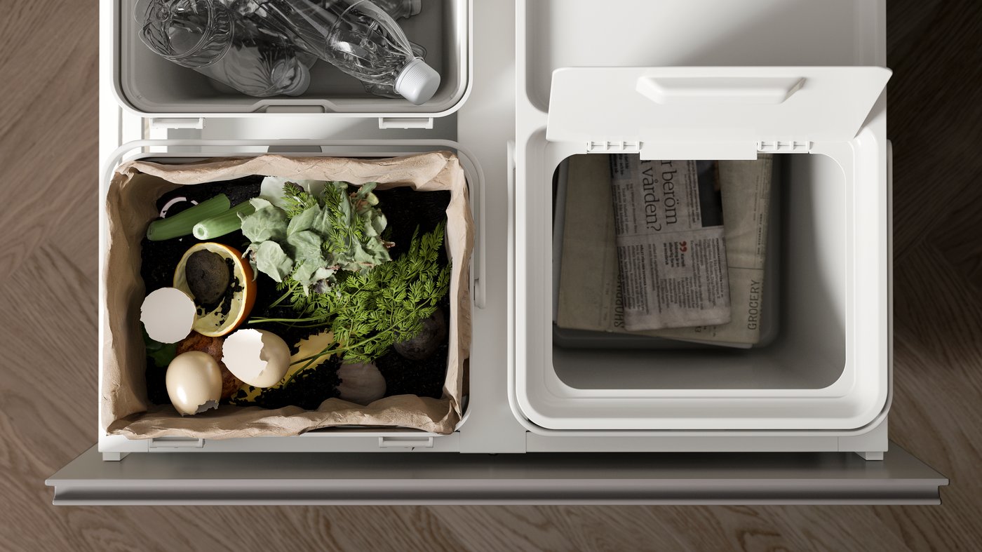 A light grey HÅLLBAR bin with lid