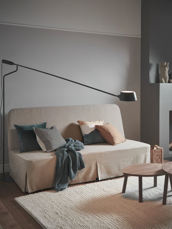 A dimmable black VÅGHÖJD LED floor lamp