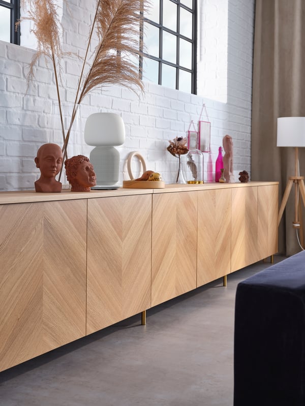 BESTÅ cabinet with fronts in herringbone patterned wooden doors.