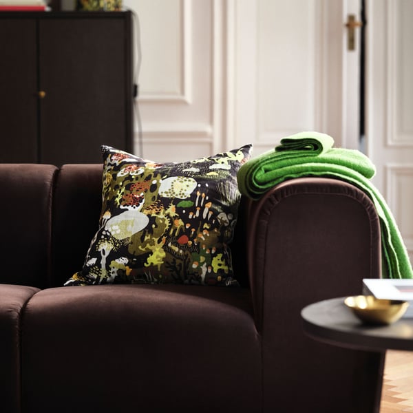 A brass-colour STOCKHOLM 2025 bowl and dish in the living room