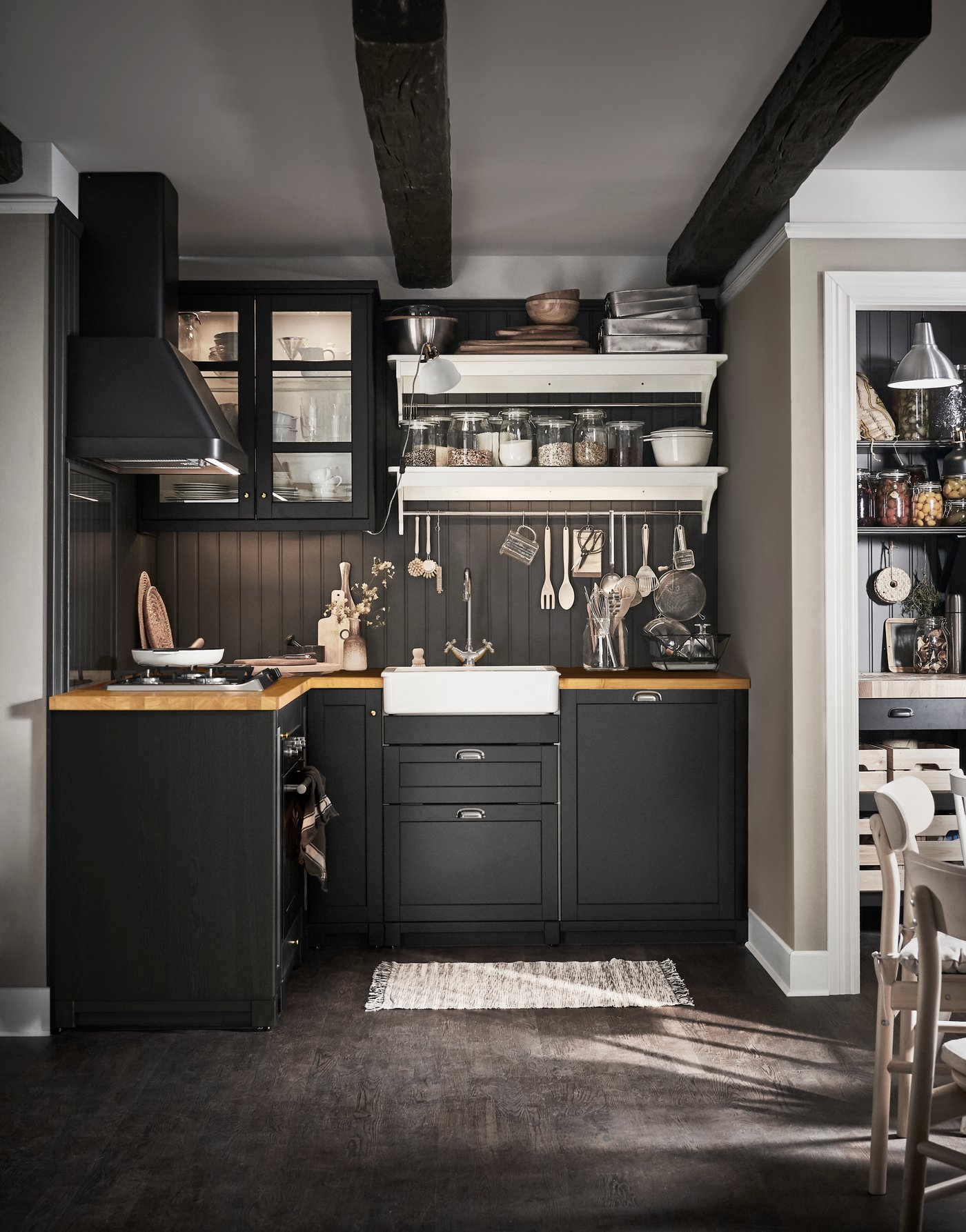 A black FOKUSERA wall mounted extractor hood in the kitchen