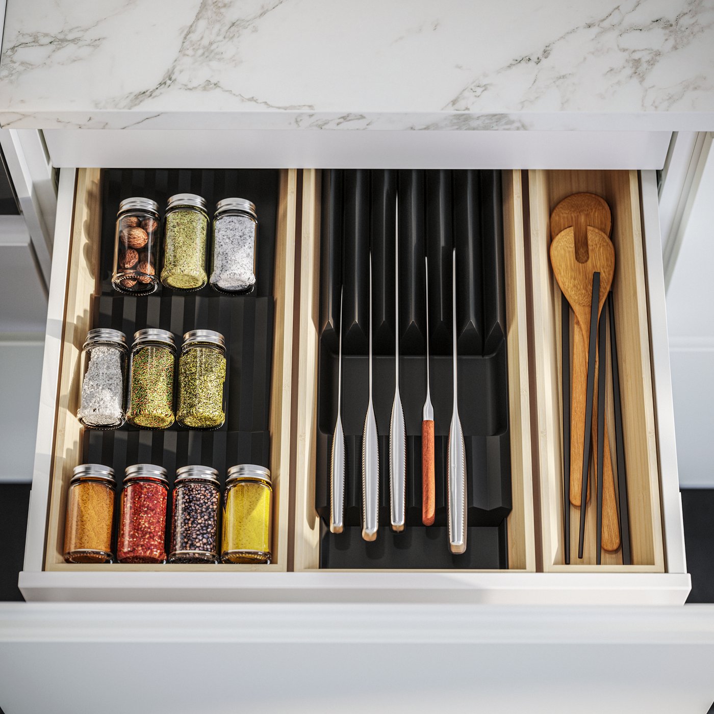 A clear glass/stainless steel GULDFISK spice jar in the kitchen