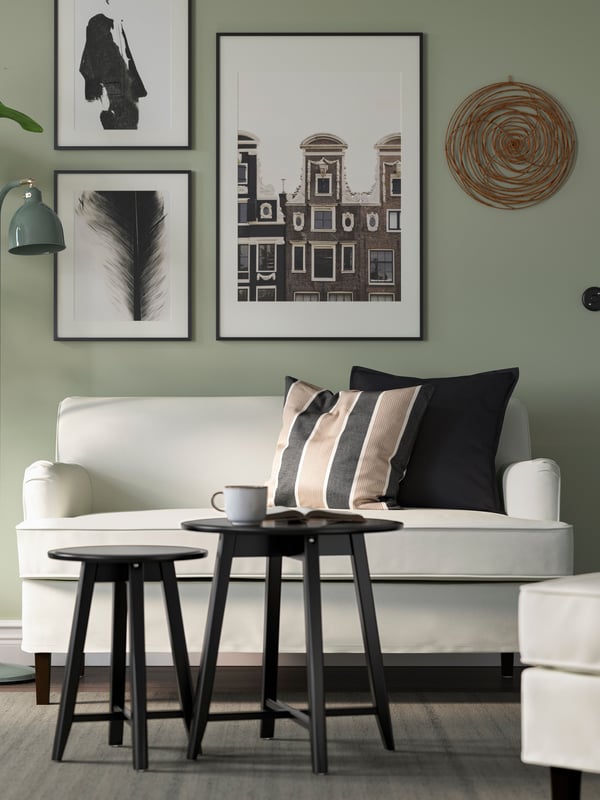 A Blekinge white ROCKSJÖN 2-seat sofa in the living room