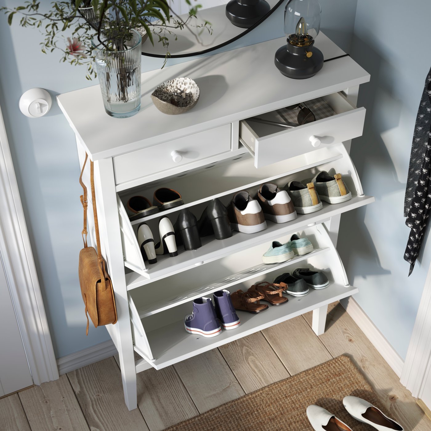 A white GULLABERG shoe cabinet with 2 compartments in the hallway