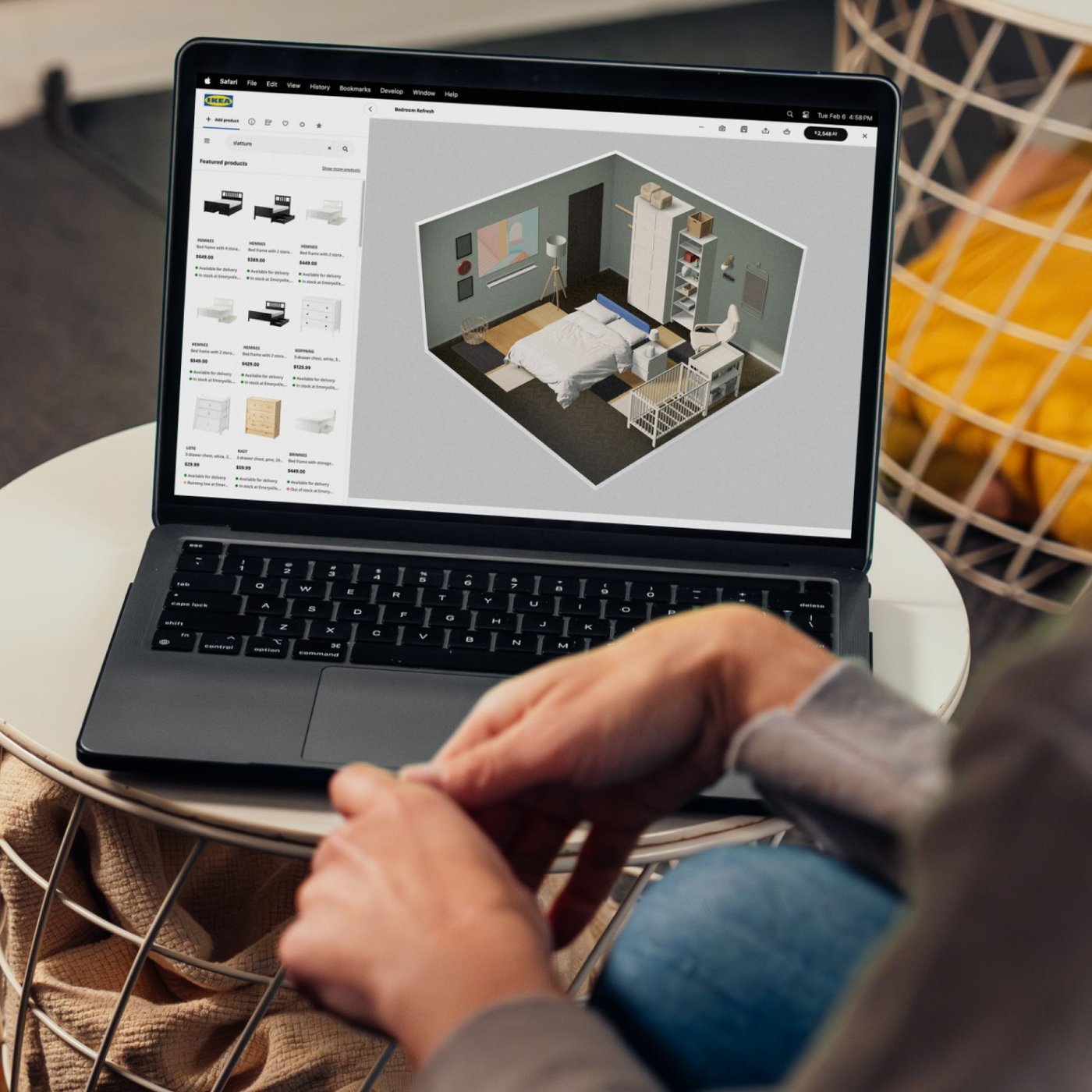 A laptop open with the design and planning tool being used to plan a bedroom.