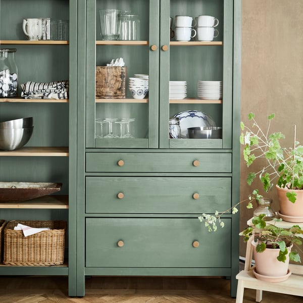 A grey-green/light brown stained HEMNES bookcase