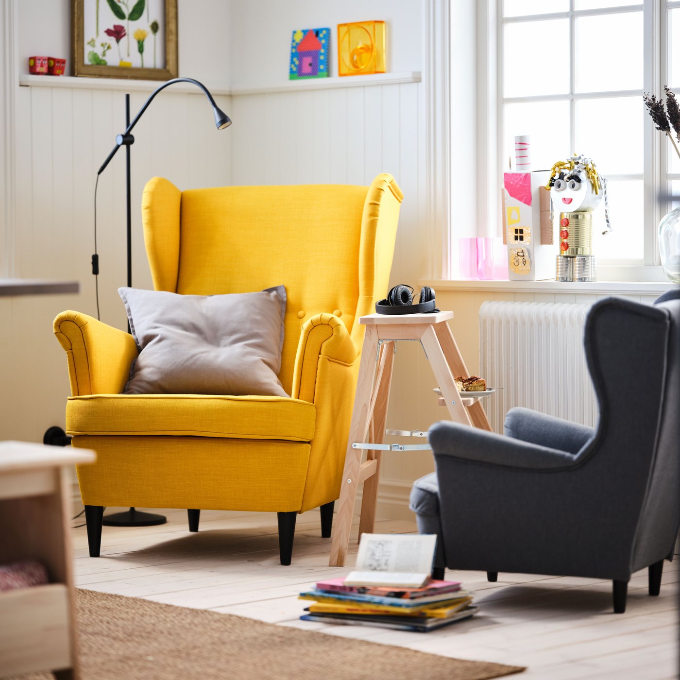 A Skiftebo yellow STRANDMON wing chair
