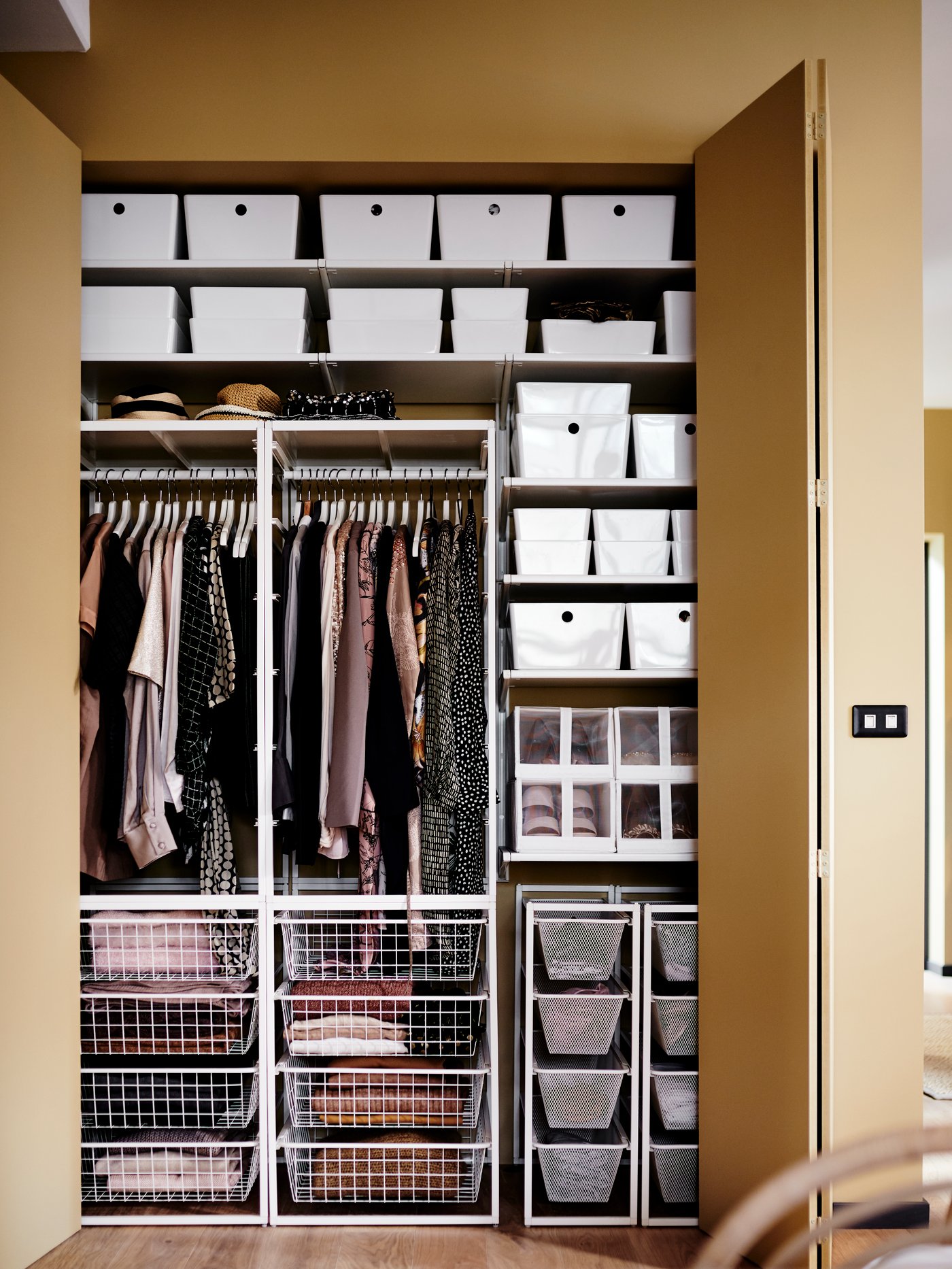 A white JONAXEL wardrobe combination in the bedroom