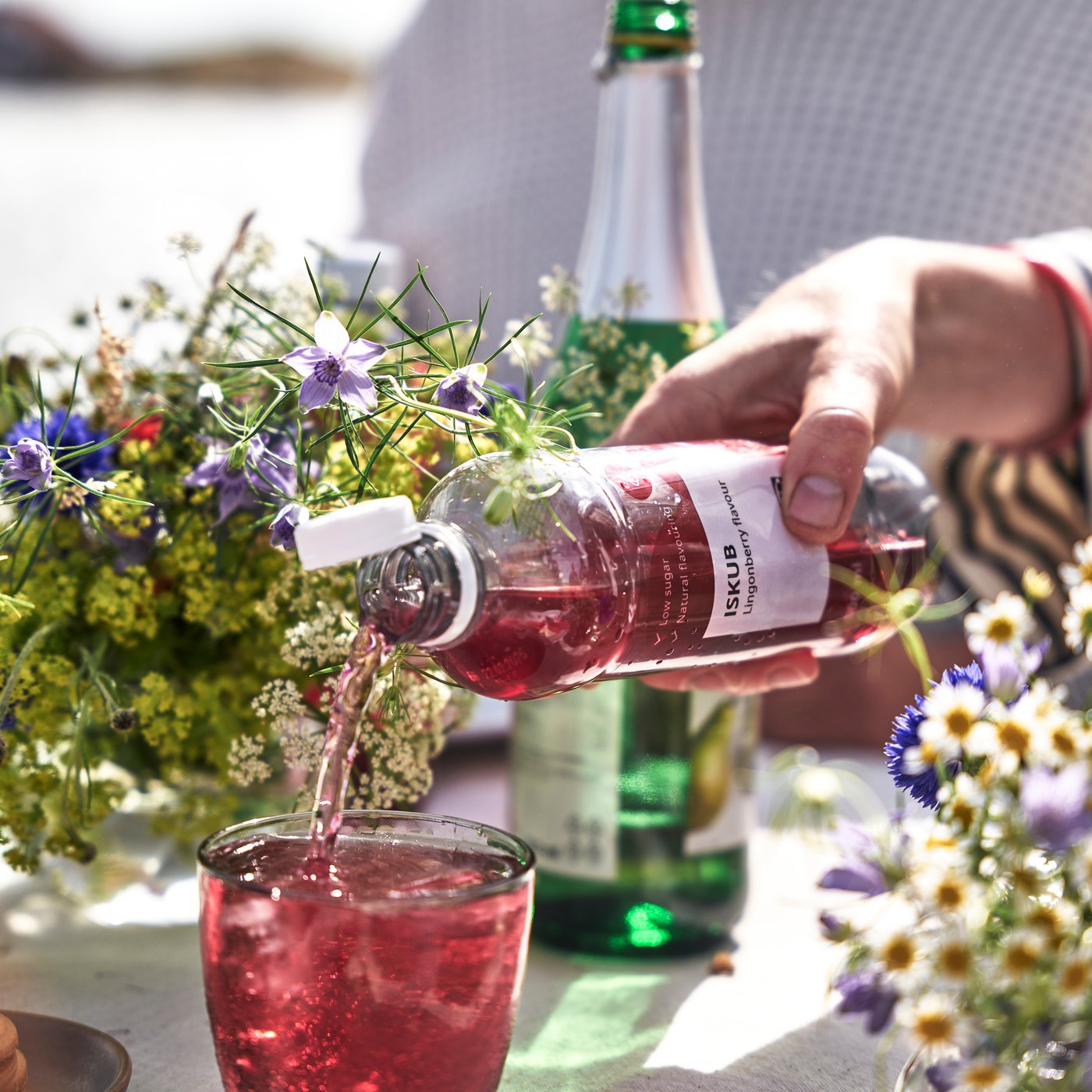 A lingonberry flavour/with sugar and sweeteners ISKUB carbonated soft drink outside