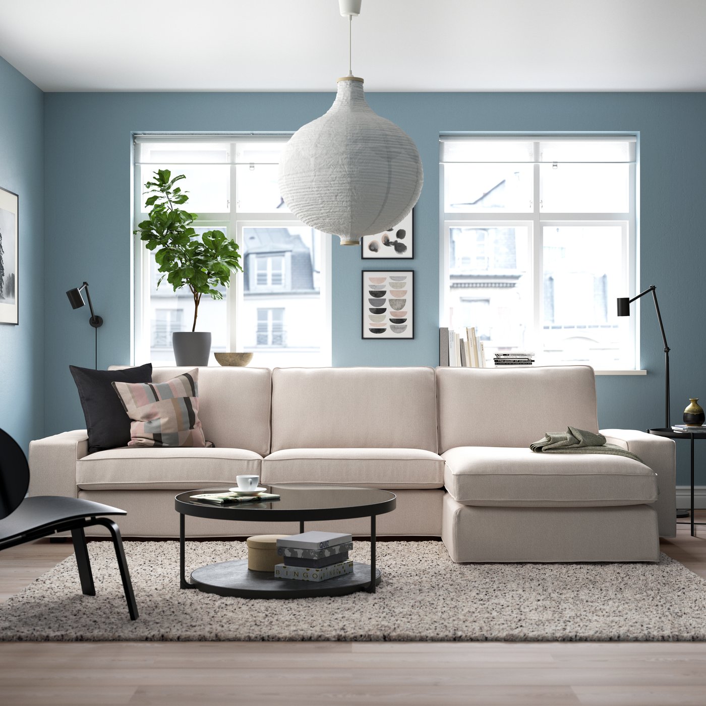A Tresund light beige KIVIK 4-seat sofa with chaise longue in the living room