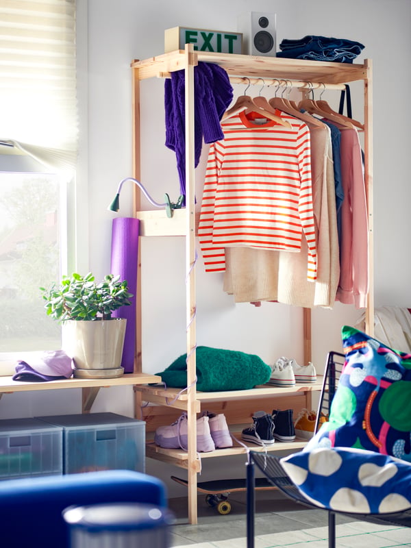 A pine KRONÖREN open wardrobe in the hallway