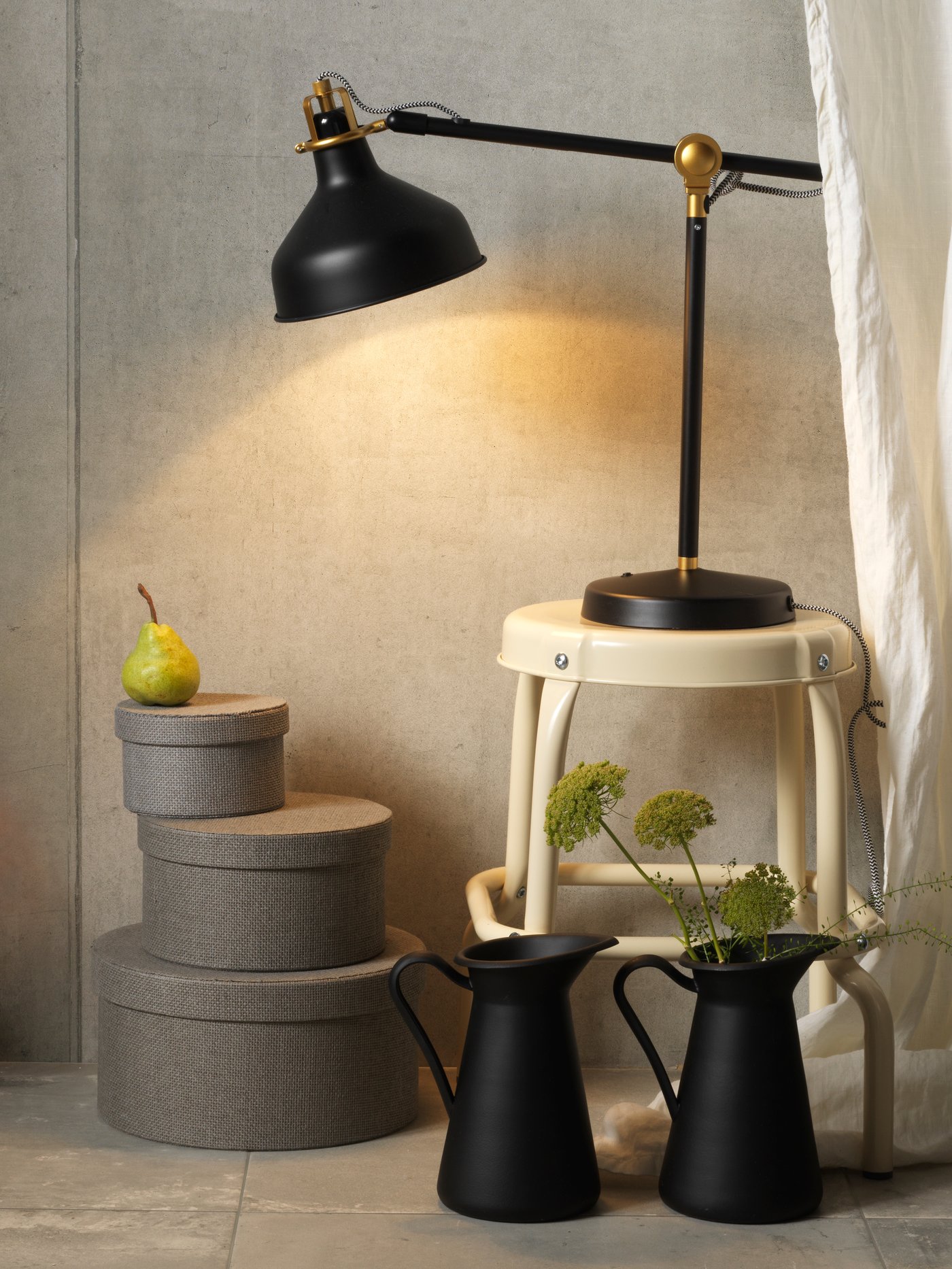 A black SOCKERÄRT vase/jug in the bedroom