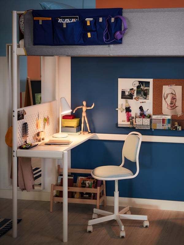 A white/blue MÖJLIGHET noticeboard/whiteboard with basket in the bedroom