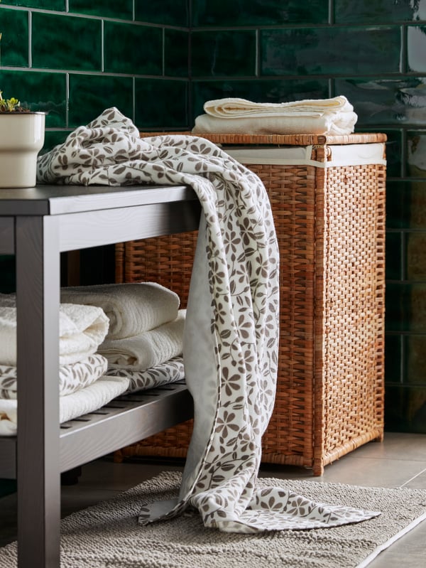 A white/grey JUVELBLOMMA bath towel in the laundry room