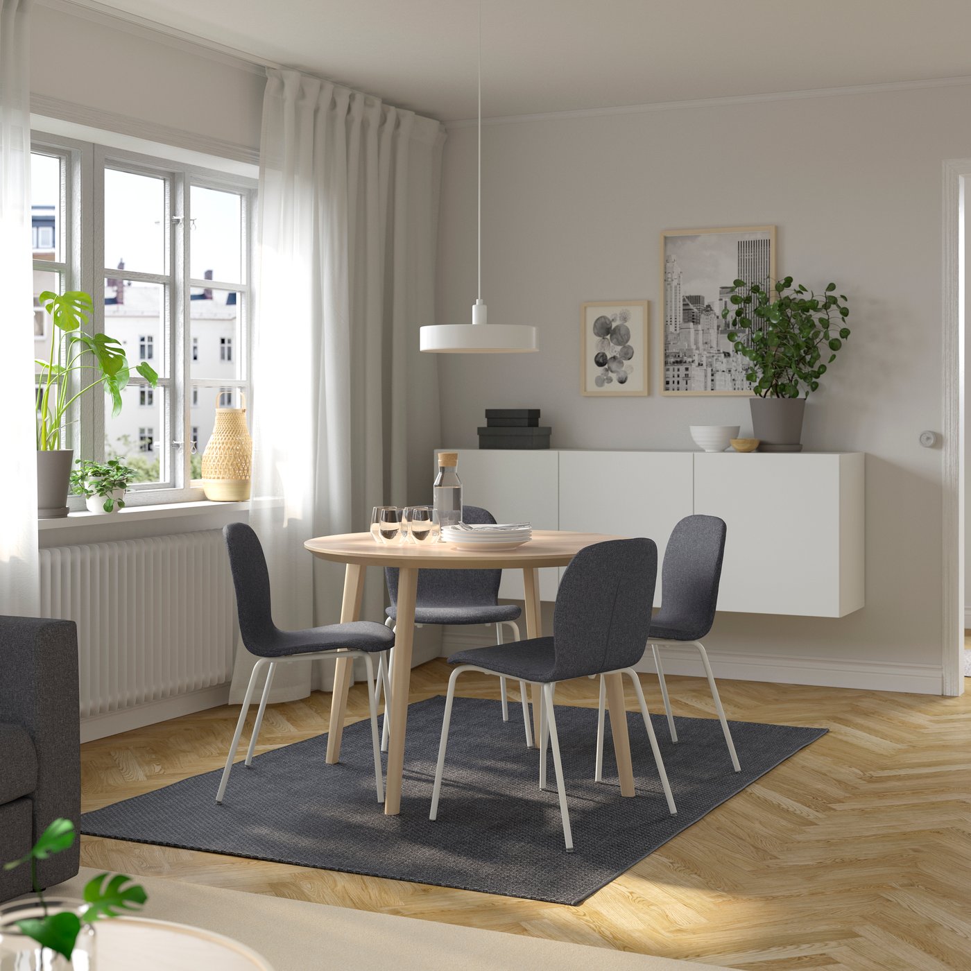 An ash veneer/Gunnared medium grey white KARLPETTER table and 4 chairs in the dining room