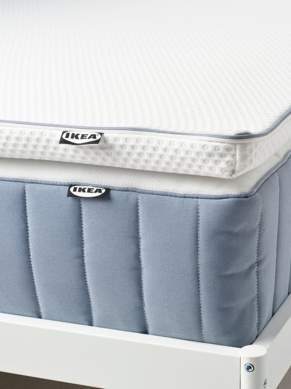 A firm/light blue VALEVÅG pocket sprung mattress