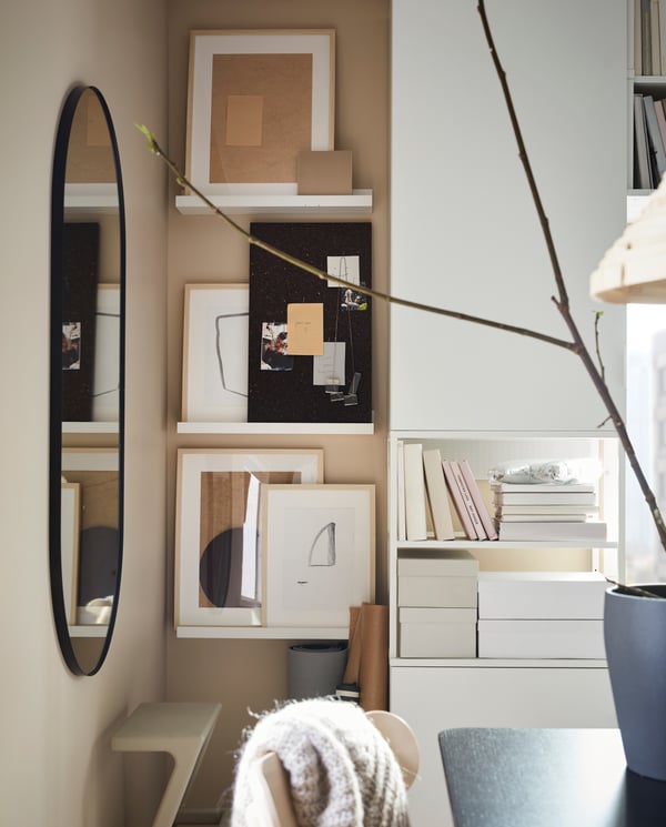 Bedroom gallery wall with picture legdes and frames 