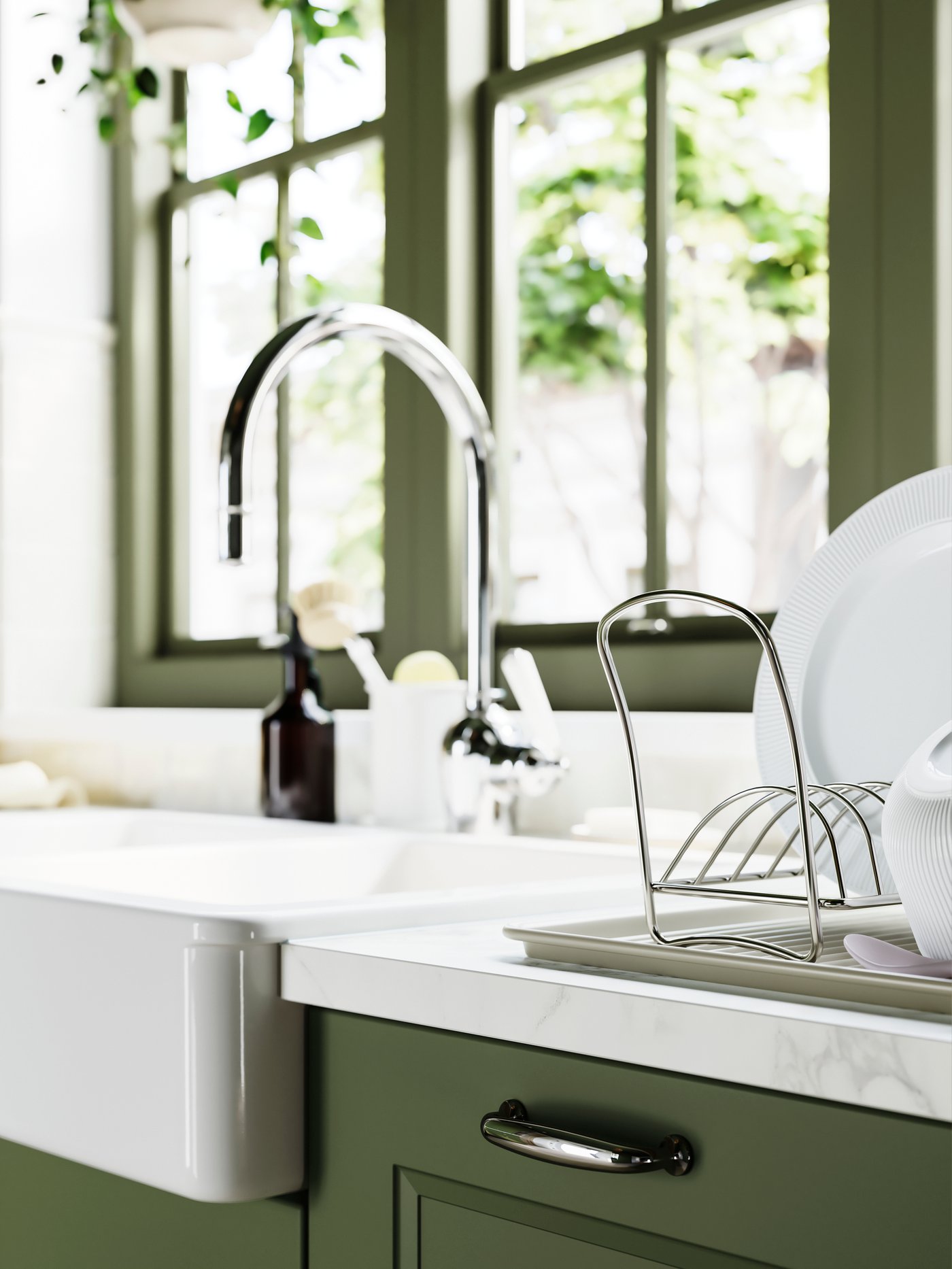 VÄLVÅRDAD dish drying rack with plates on a kitchen counter next to a sink with a chrome tap and a soap dispenser.