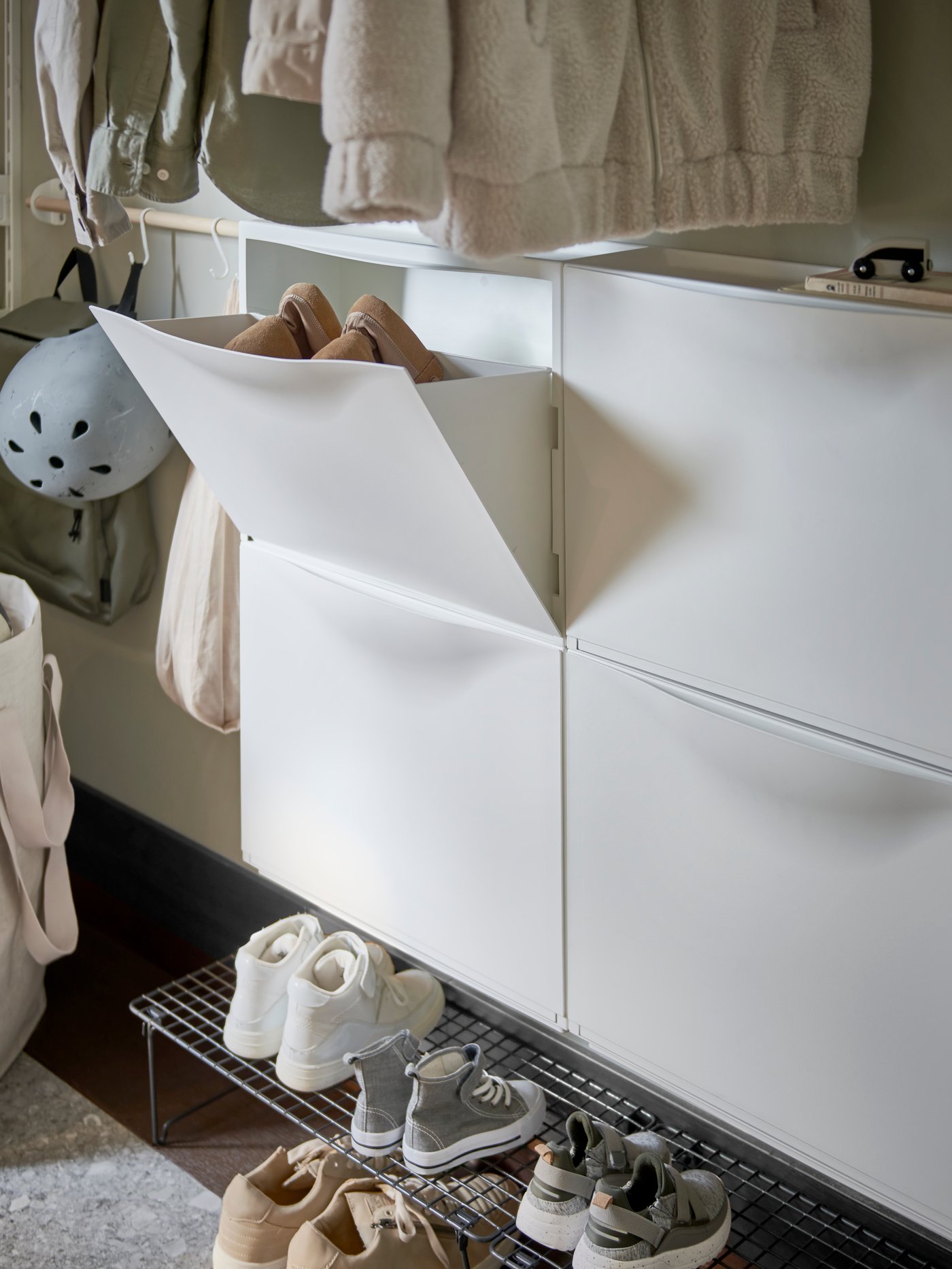 A white TRONES shoe cabinet/storage