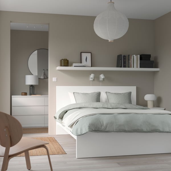 A white MALM bed frame, high