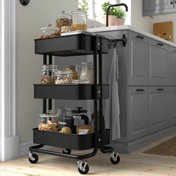 A black RÅSKOG trolley
