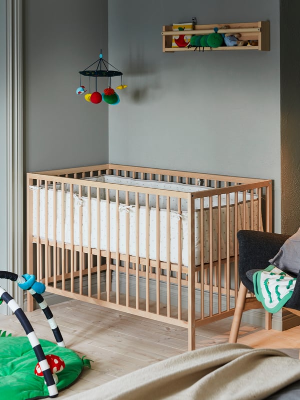 A beech SNIGLAR cot in the childrens room