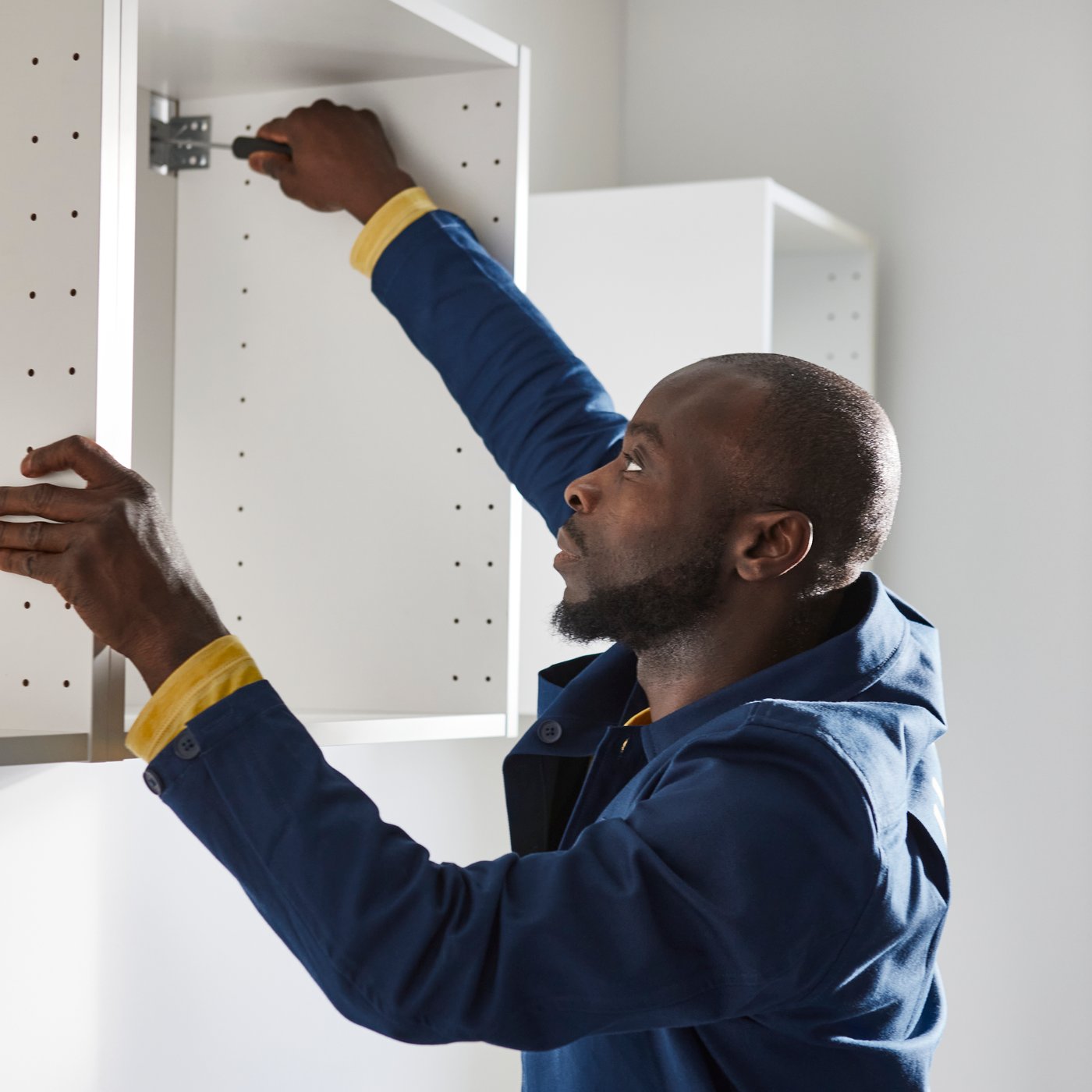An IKEA coworker is installing a kitchen
