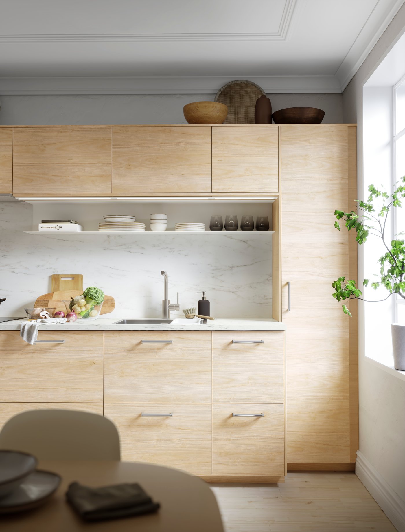 A light ash effect ASKERSUND drawer front in the kitchen