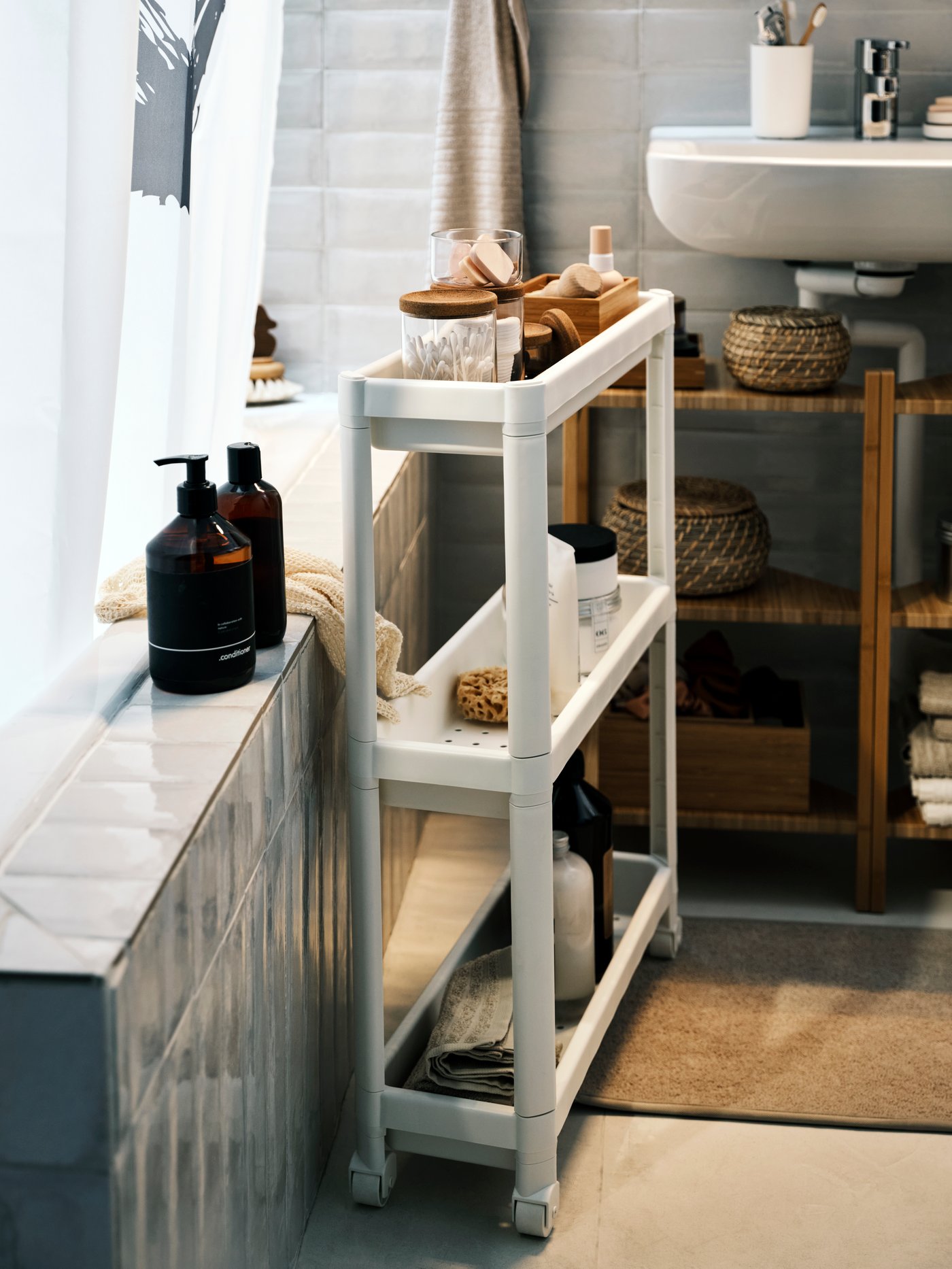 White VESKEN trolley beside tub