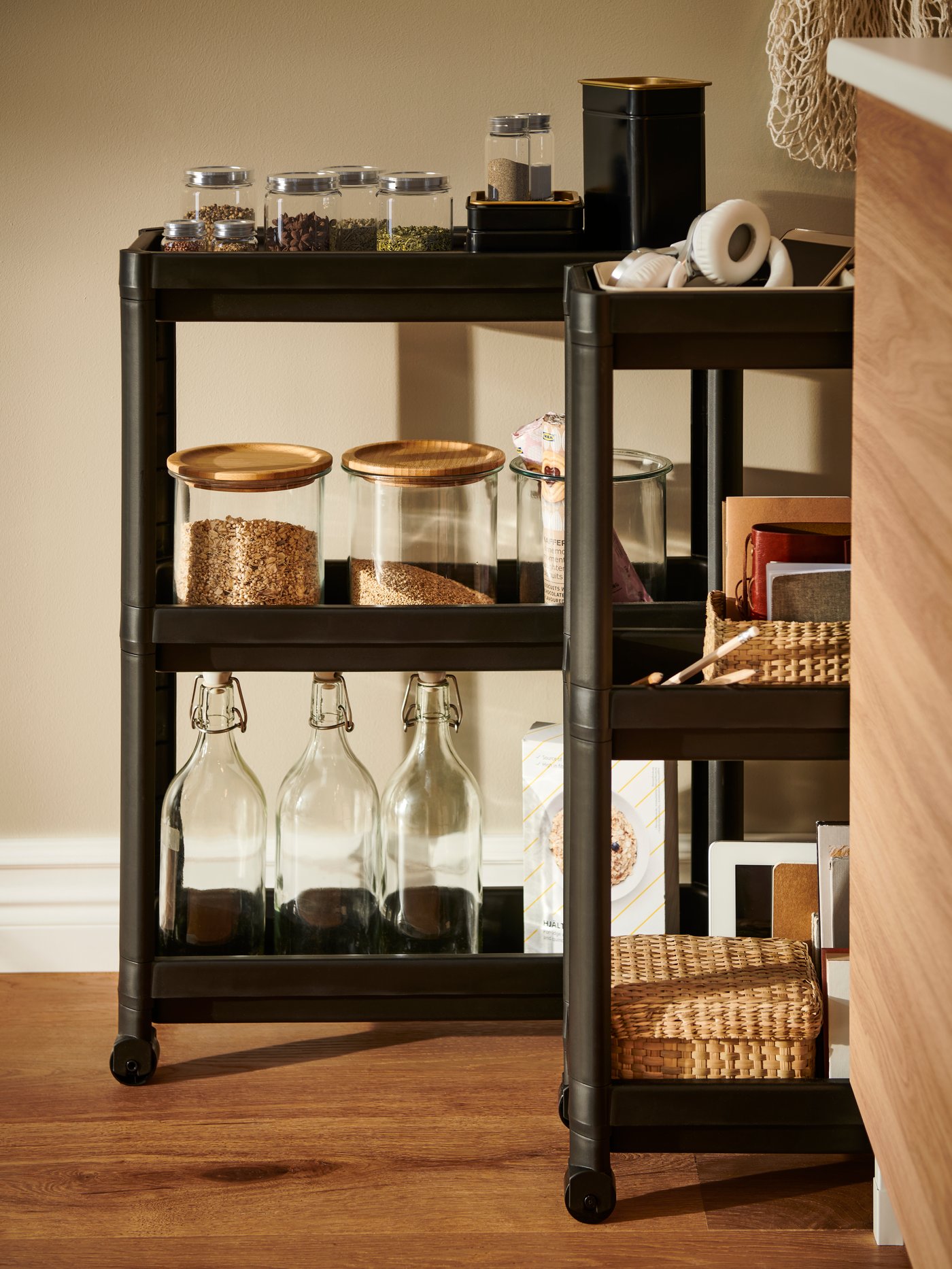 A black VESKEN trolley in the kitchen