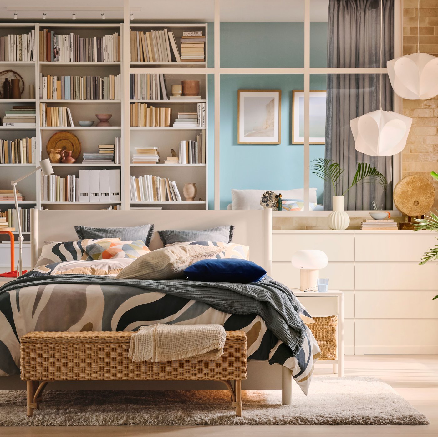 Two white BÄCKNATE pendant lampshades hang above white MALM chests of 4 drawers near a bedroom window.