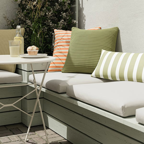 Patio corner with outdoors seating and table​.